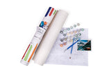 Roll of paper, markers, and a photo on a white background