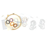 Embroidery kit with hoop, threads, and printed patterns of dogs on a white background
