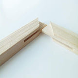 Close-up of a wooden frame corner on a white background