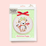Embroidery craft kit with a Christmas puppy design on a pink background