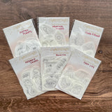 Set of clear stamp sets from Eight22 Crafts on a wooden surface