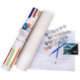Paint by numbers kit with rolls of paper, paint bottles, and a completed painting on a white background