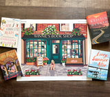 Illustration of Winnie's Book Shop with books around it on a wooden surface