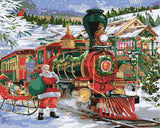 Santa Claus with a sleigh next to a Christmas-themed train in a snowy village scene.