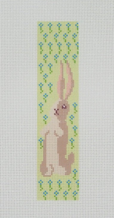 Needlepoint canvas design of a rabbit with flowers on a light gray background