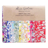 Pack of Liberty Tana Lawn fabric squares with a brown label on a white background