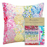 Colorful Liberty fabric epp hexagon cushion kit with packaging on a white background
