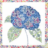 Floral patterned fabric with a blue flower design on a white background