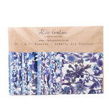 Pack of Liberty Art Fabrics squares with floral patterns on a cardboard sleeve, brand 'Alice Caroline' visible.