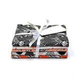 Pack of fabric sheets with a white ribbon on a white background