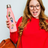 Person holding a pink water bottle with cartoon character stickers against a light gray background