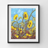 Framed painting of sunflowers with a blue sky background