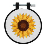 Embroidery hoop with a sunflower design on a white background