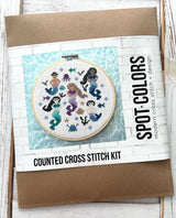 Counted cross stitch kit with mermaid design on a white background