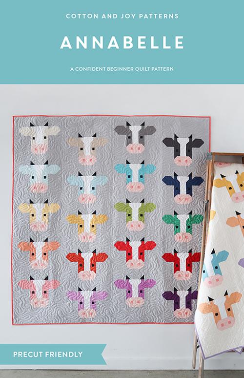 The Annabelle quilt pattern with a quilt of cow heads in various color patterns.