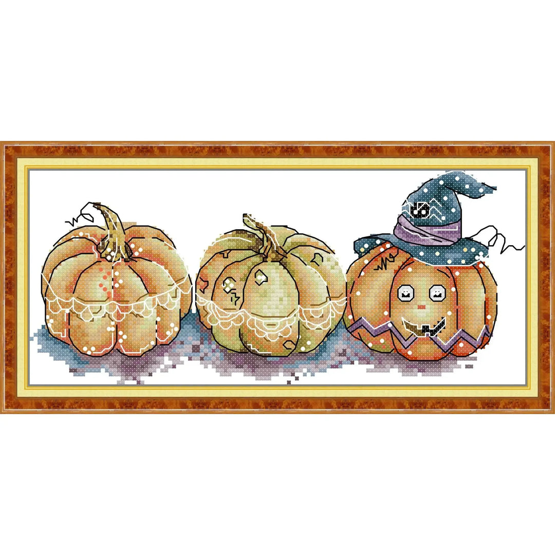 Beginners Cross Stitch Halloween pumpkins with decorative elements on a white background
