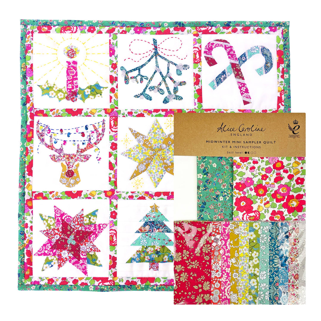 Quilt kit with colorful patterns and a label on a white background