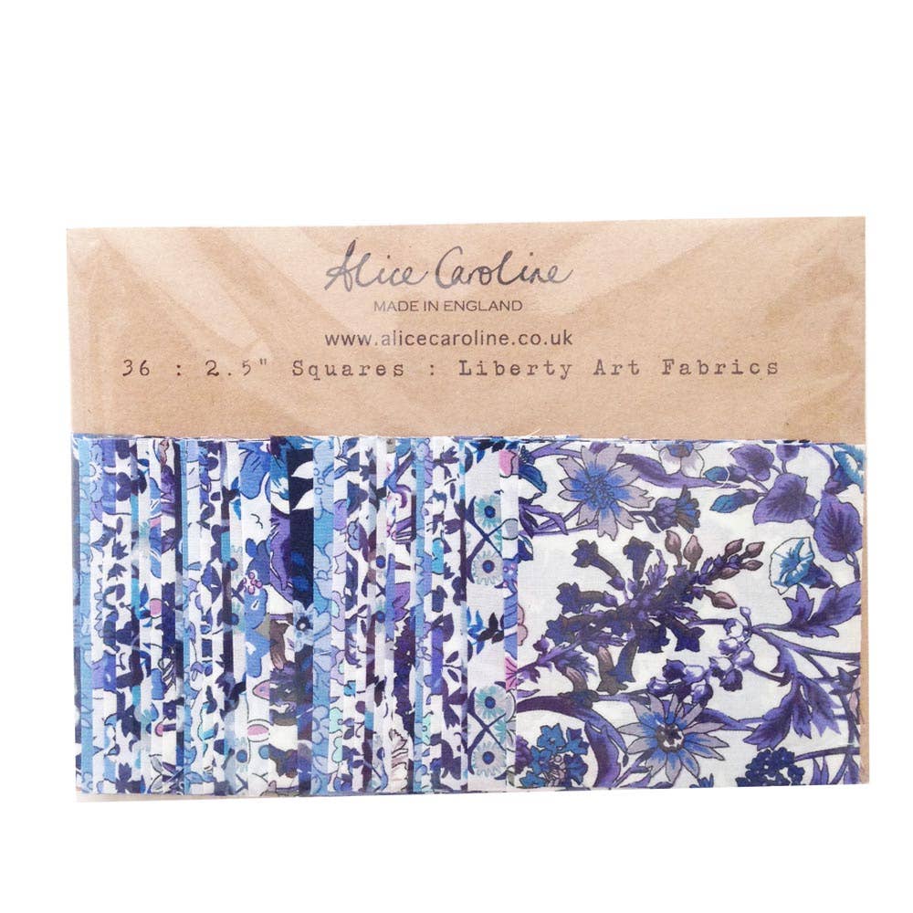 Pack of Liberty Art Fabrics squares with floral patterns on a cardboard sleeve, brand 'Alice Caroline' visible.