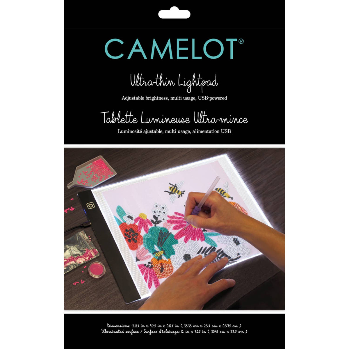 Camelot ultra-thin lightpad with a hand using it to draw on a floral design.