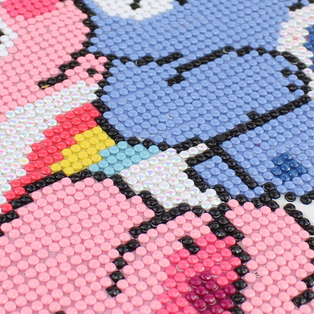Close-up of a colorful mosaic design with pink, blue, and black elements.