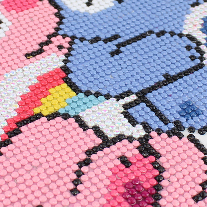 Close-up of a colorful mosaic design with pink, blue, and black elements.