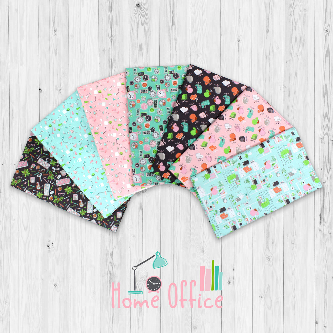 Set of fabric swatches with various patterns on a wooden surface, featuring the brand 'Home Office'.