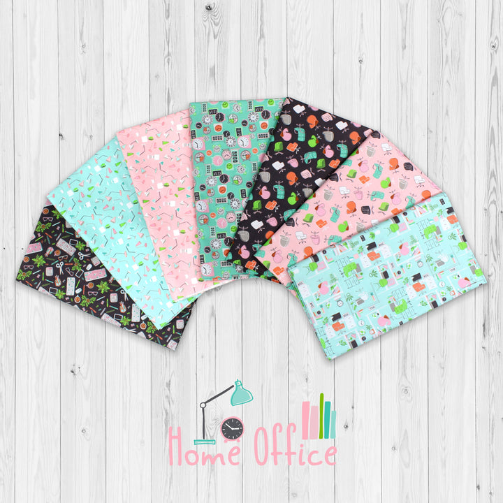 Set of fabric swatches with various patterns on a wooden surface, featuring the brand 'Home Office'.