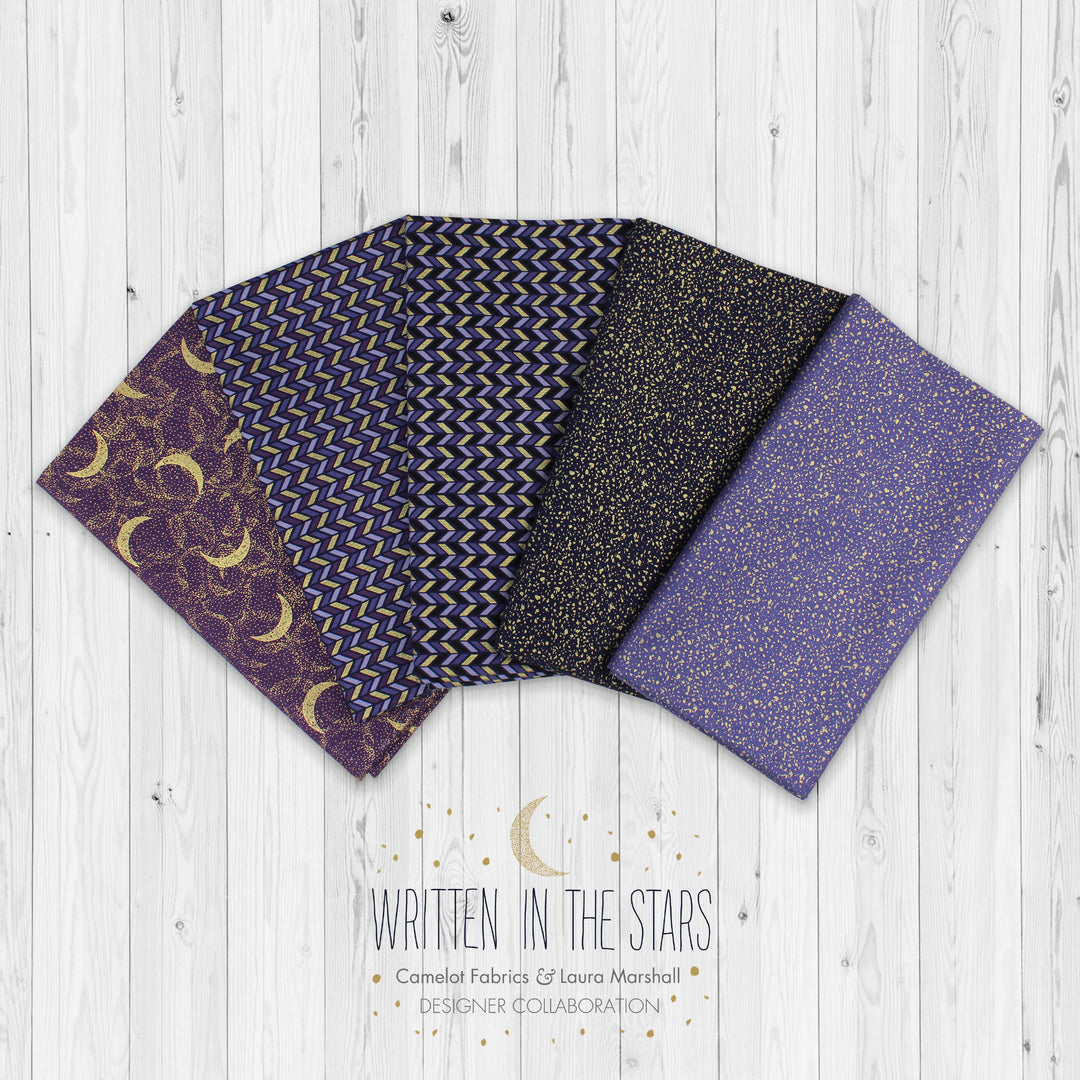 Four fabric swatches with celestial patterns on a wooden surface, labeled 'Written in the Stars'.