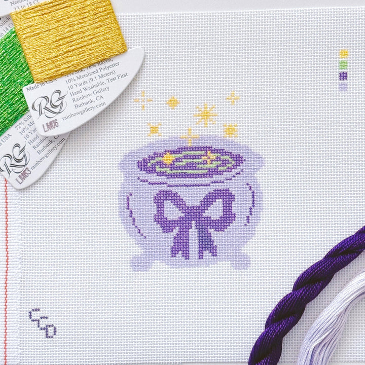 Cotswold Co Designs - Magic Cauldren Halloween Needlepoint Canvas, 18 mesh, 4x4” design, modern trendy needlepoint canvas, bow Halloween needlepoint - Pisgah Needleworks