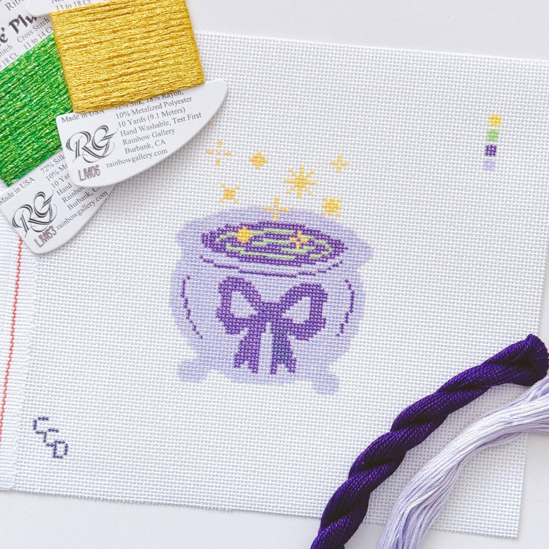 Cotswold Co Designs - Magic Cauldren Halloween Needlepoint Canvas, 18 mesh, 4x4” design, modern trendy needlepoint canvas, bow Halloween needlepoint - Pisgah Needleworks