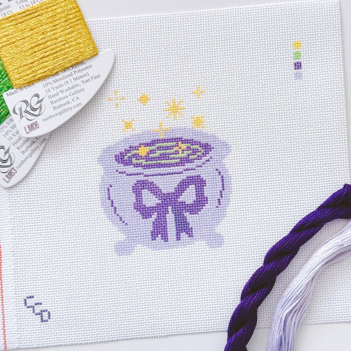 Cotswold Co Designs - Magic Cauldren Halloween Needlepoint Canvas, 18 mesh, 4x4” design, modern trendy needlepoint canvas, bow Halloween needlepoint - Pisgah Needleworks