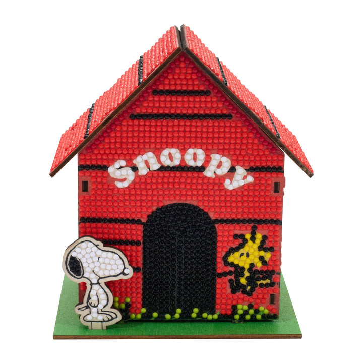 Red doghouse with 'Snoopy' text and a small figure of Snoopy in front on a white background