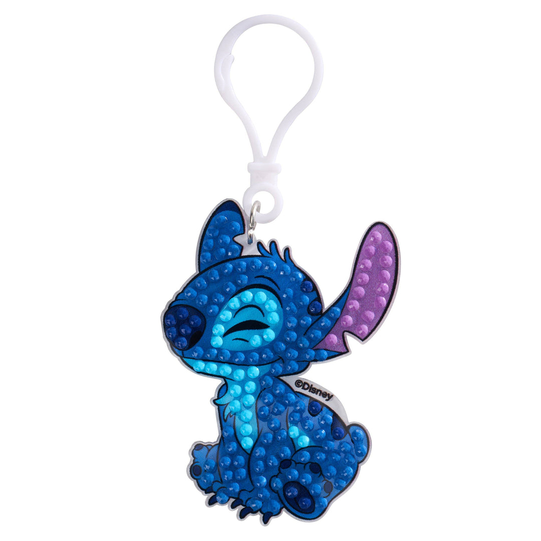 Keychain with a blue and purple dragon design on a white background