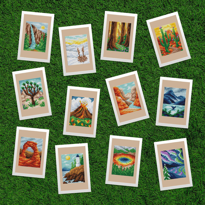 Set of cross-stitched landscape pictures on a grass background