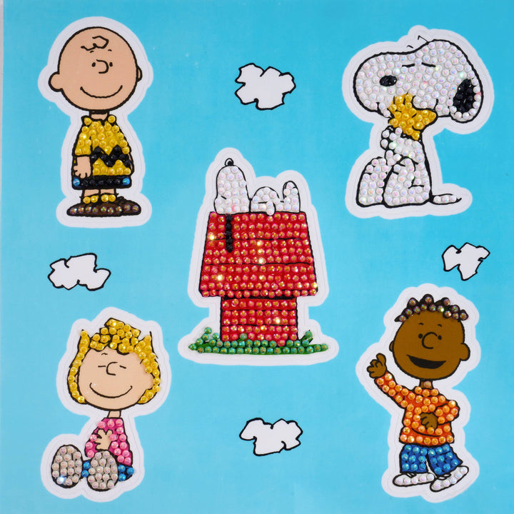 Sticker set with cartoon characters including Charlie Brown, Snoopy, and others on a blue background.