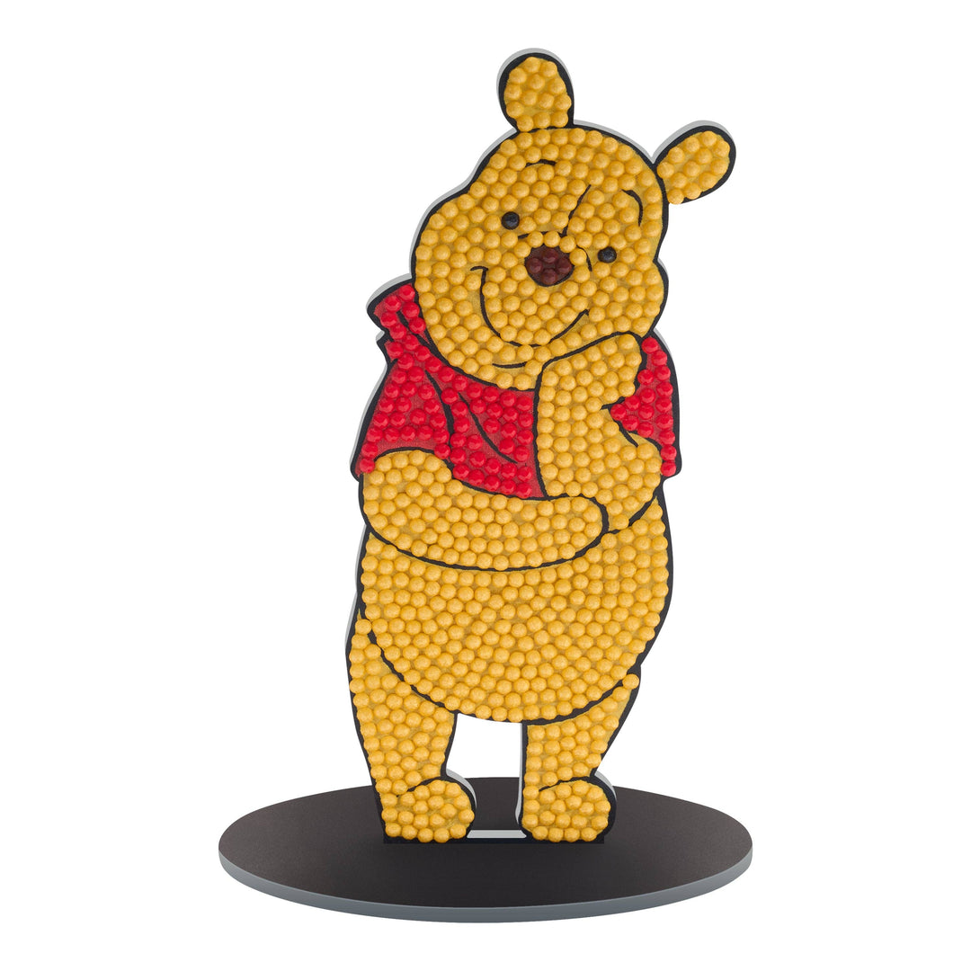 Yellow bear character with a red sweater on a white background