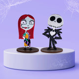 Two decorative The Nightmare Before Christmas Diamond Art figures of a character with red hair and another skeleton on a purple platform with spider web designs.