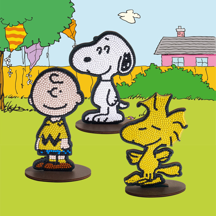 Three cartoon characters on stands with a colorful background