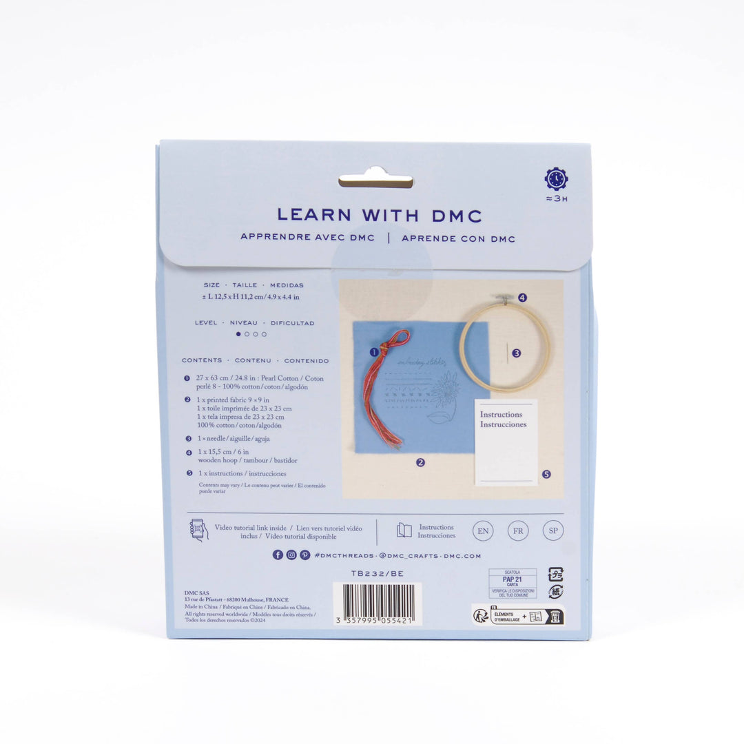 DMC embroidery kit packaging with text and images on a white background