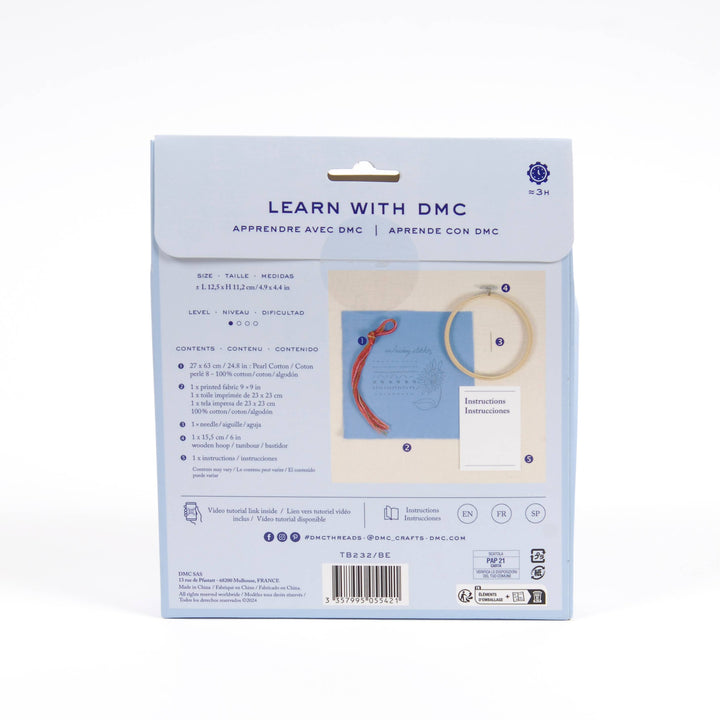 DMC embroidery kit packaging with text and images on a white background
