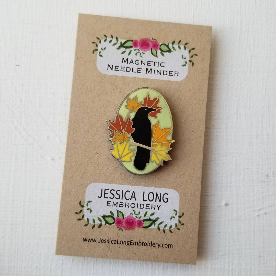 Magnetic needle minder with a bird and leaf design on a brown card with 'Jessica Long Embroidery' branding.