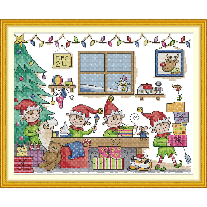 Cross-stitched scene of elves around a Christmas tree with presents and decorations.