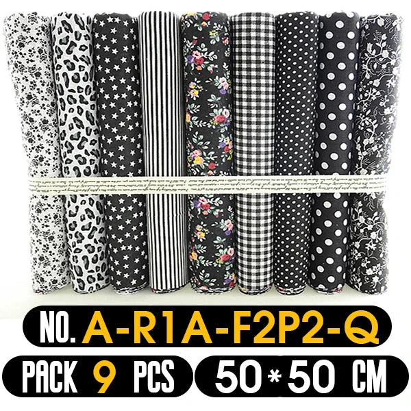 Set of 9 black and white patterned fabric rolls in a package.