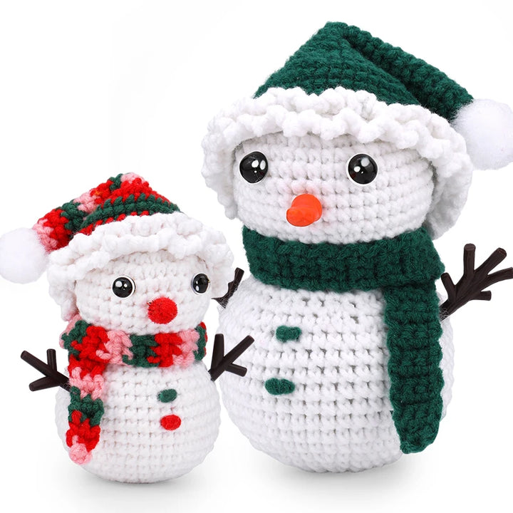 Two crocheted snowmen with festive hats and scarves on a white background