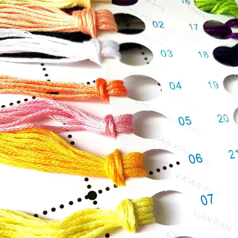 Color swatches with embroidered tassels on a white background
