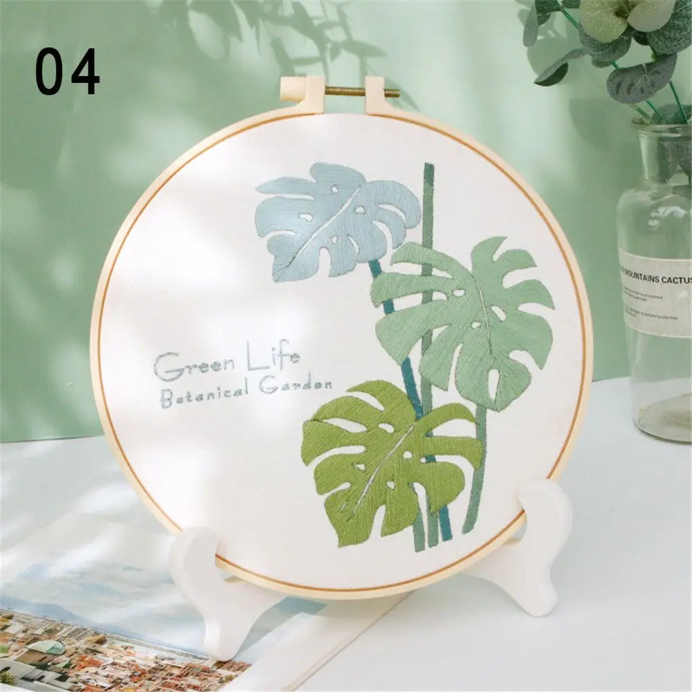 Decorative plate with leaf design on a stand against a light green background
