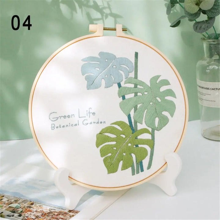 Decorative plate with leaf design on a stand against a light green background