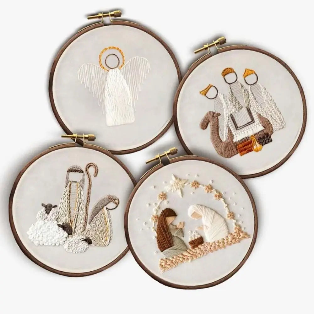 Four embroidered hoops with religious-themed designs on a white background