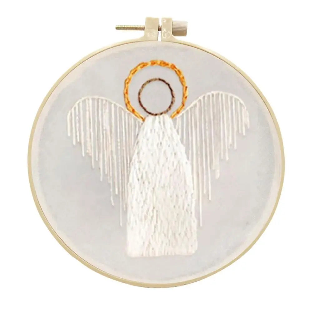Embroidery hoop with an angel design on a white background