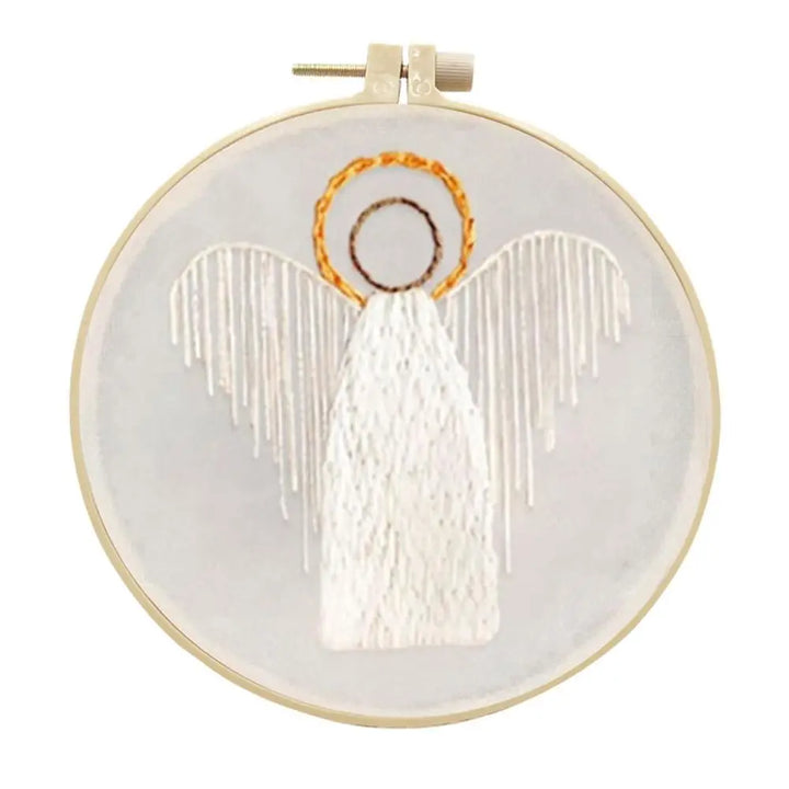 Embroidery hoop with an angel design on a white background